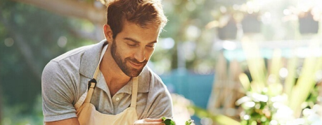 Photo of man with plants